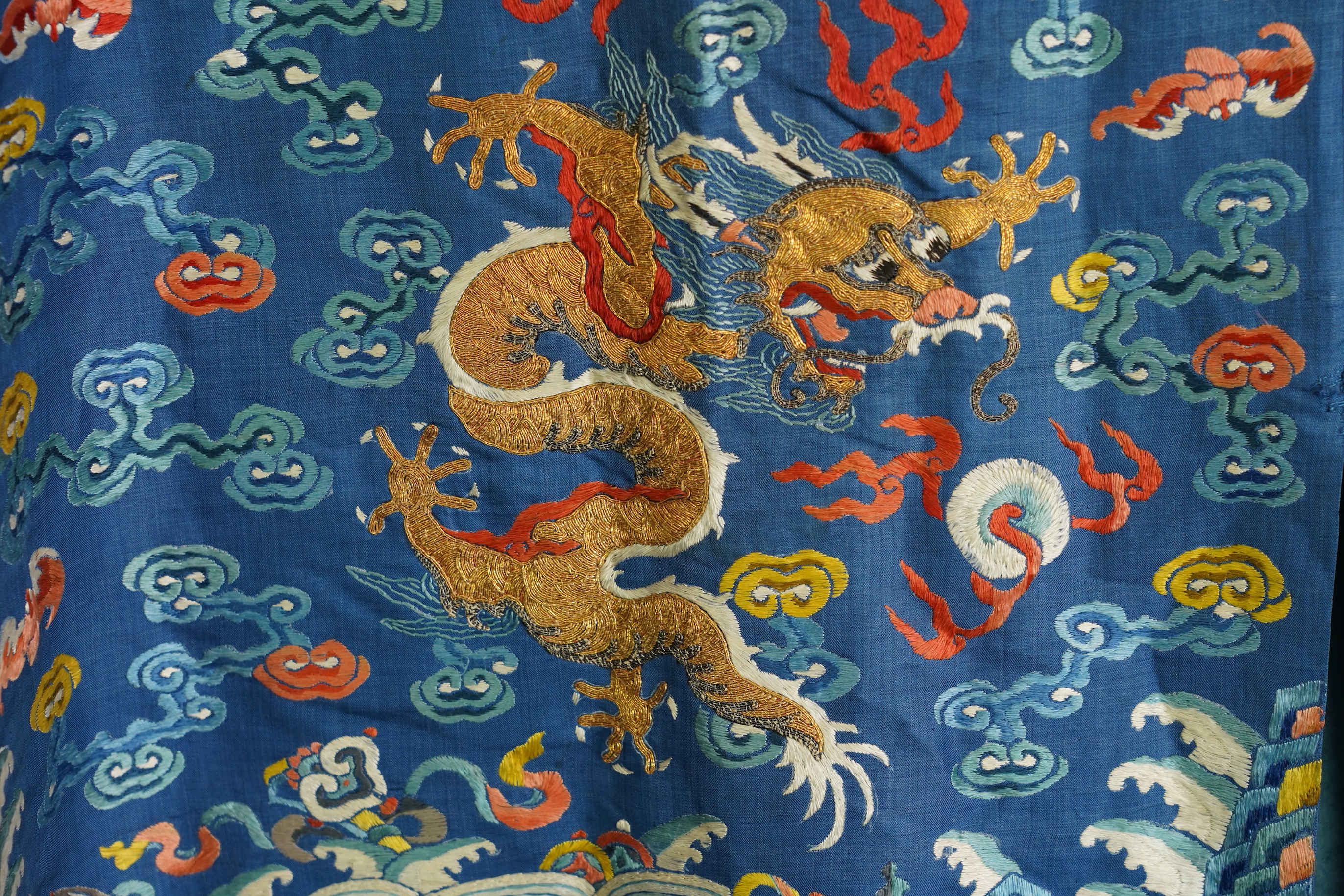 A Chinese blue silk man’s dragon robe, jifu, 19th century